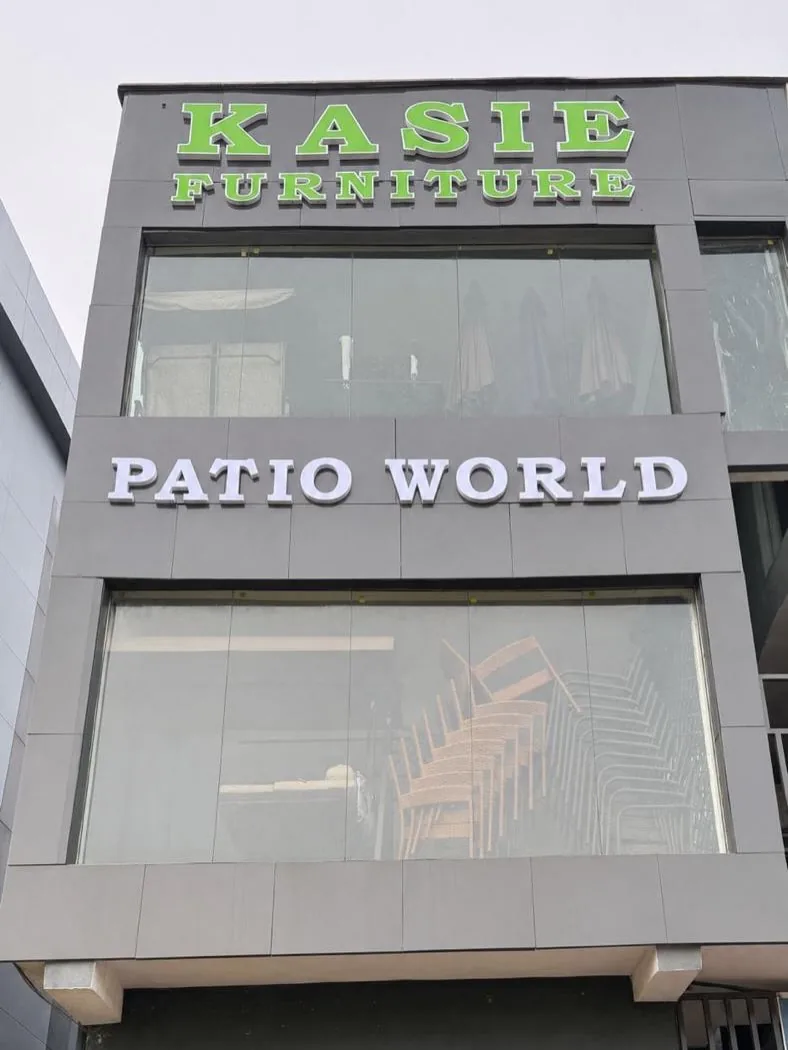 Front of the Kasie Furniture Building with Kasie Furniture and Patio World signage